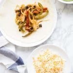 Chicken fajitas with avocado sauce and cheddar cheese