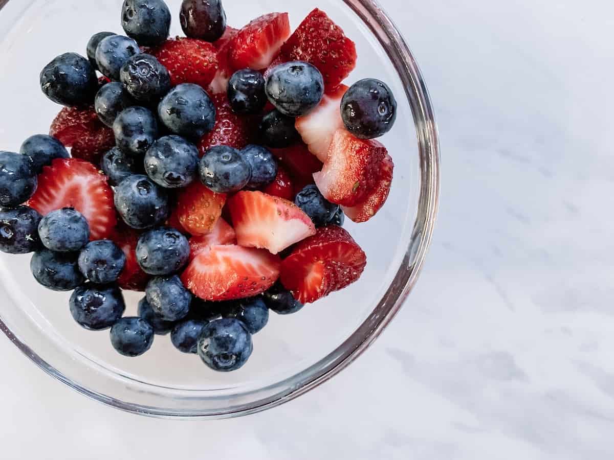 bowl blueberries and sliced strawberries
