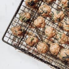 cooked meatballs on a baking sheet