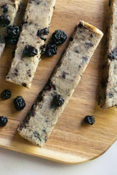 wooden serving board with soft baked blueberry almond snack bars