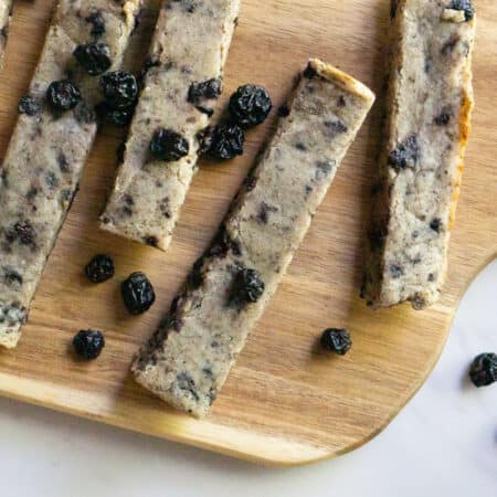 wooden serving board with soft baked blueberry almond snack bars