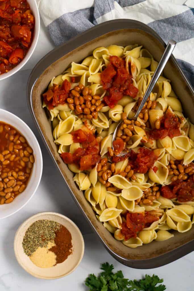 Image of assembling the tomato bean pasta bake.